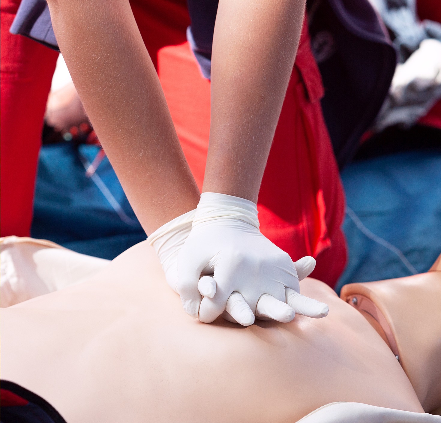 Person performing CPR on mannequin